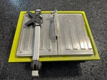 Ryobi 4.8 -amps 7 In. Blade Corded Tabletop Wet Tile Saw. Fixed Price $70.00.