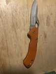 Primos Truth Orange Lockback Folding Knife. Fixed Price $10.00.