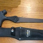 Camillus Titanium Saw Black Rubber Handle With Sheath. Fixed Price $10.00.
